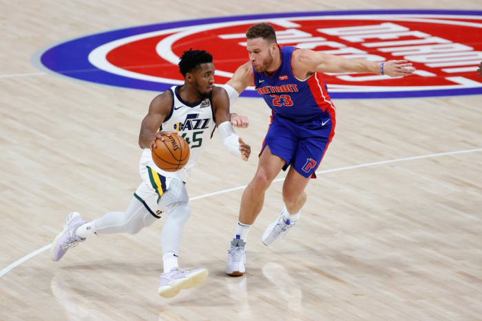 Blake Griffin (23) guards Donovan Mitchell (45) in a matchup between the Jazz and the Pistons